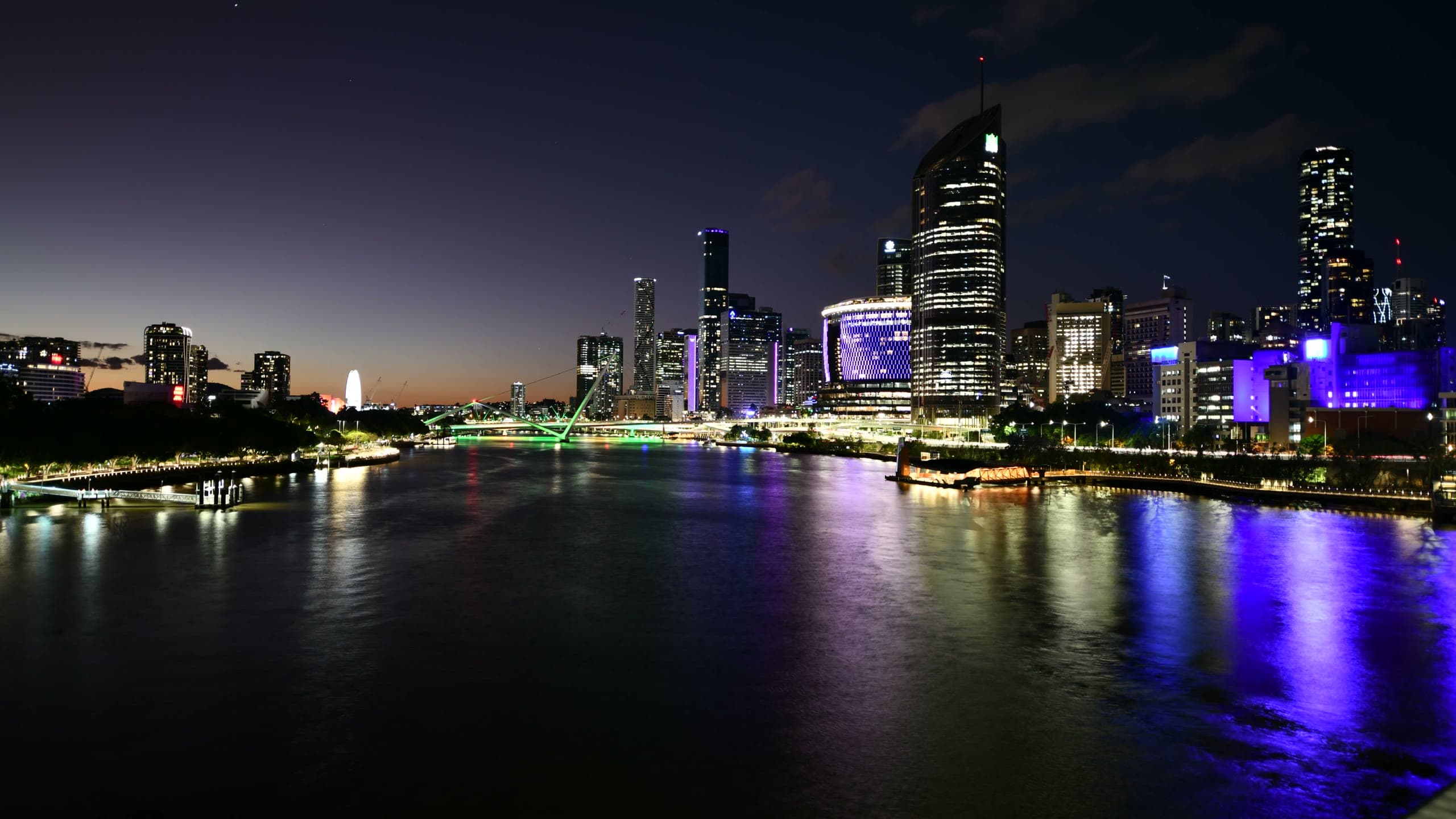 Aerial view of the Brisbane CBD skyline at twilight over the Brisbane River